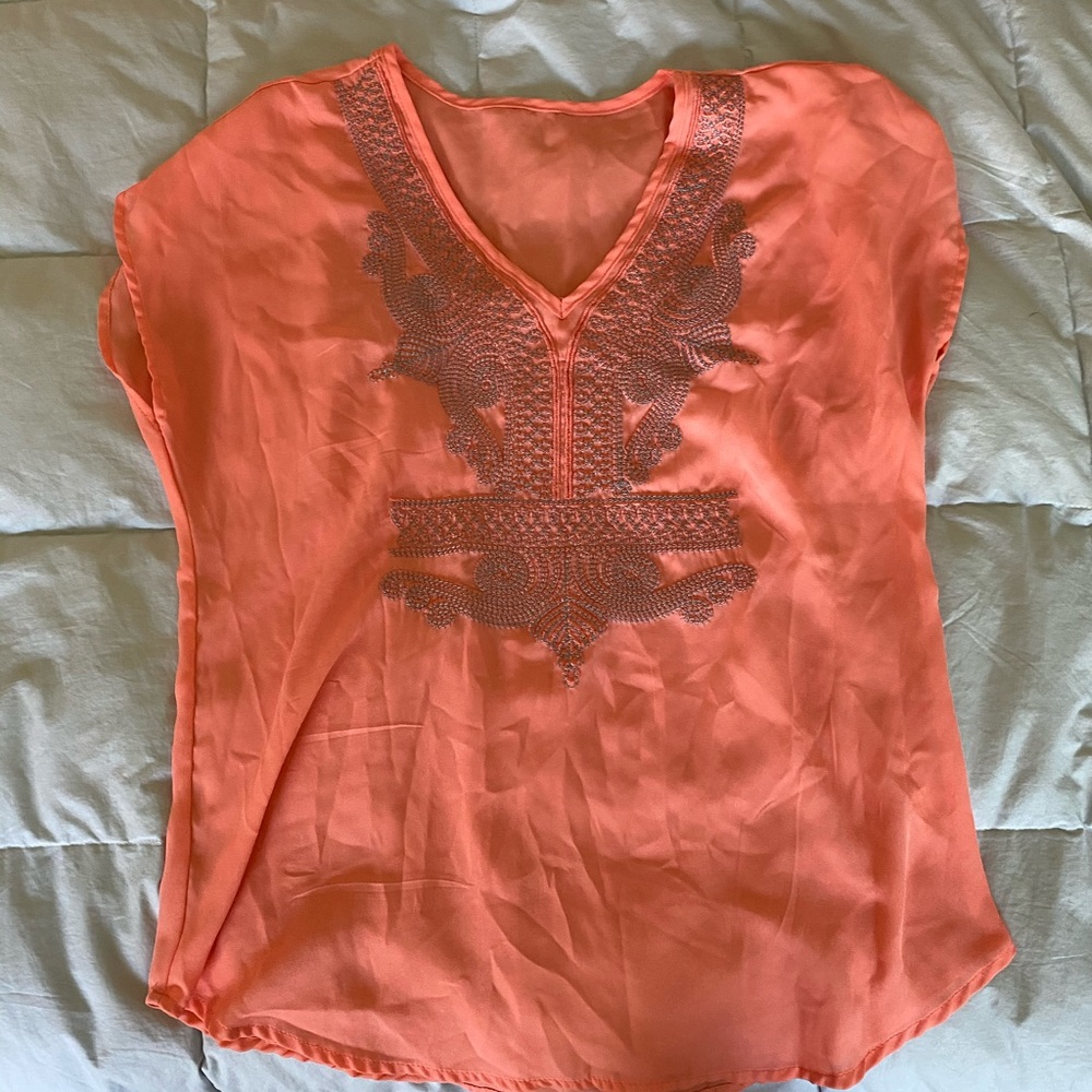 orange flowy shirt